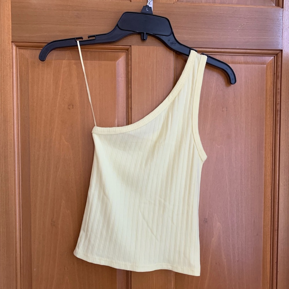 A one shoulder neon tank.